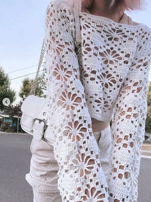 A model wearing the shirt in white, paired with white jeans.