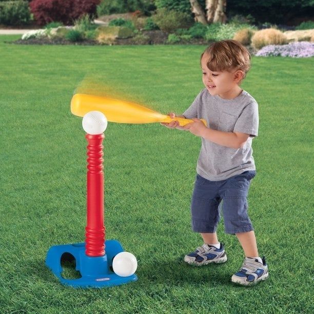 Kid playing T-ball