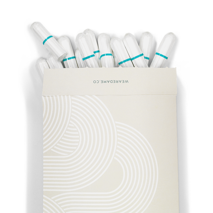 A paper envelope with cotton tampons spilling from the top.