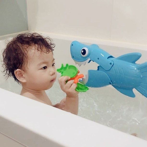Baby with shark grabber