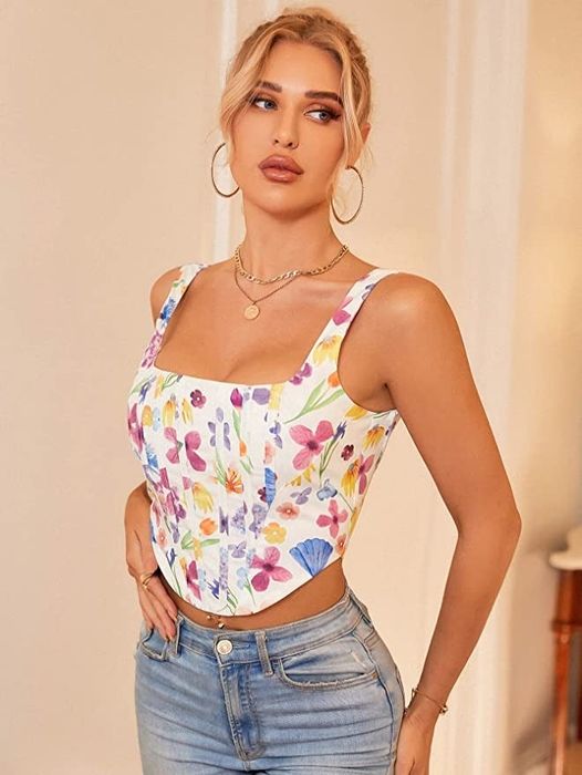 A model showcasing the white floral corset top.