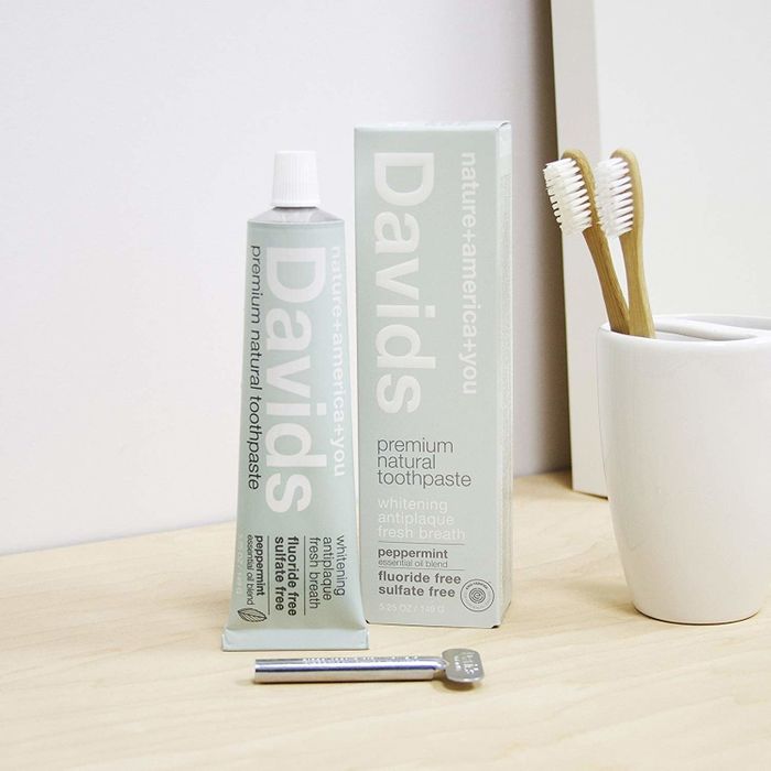 The toothpaste packaging, a tube, and a metal key used to squeeze out any remaining product.