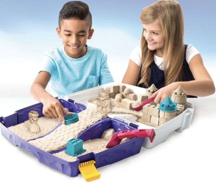 Kids playing with kinetic sand kit