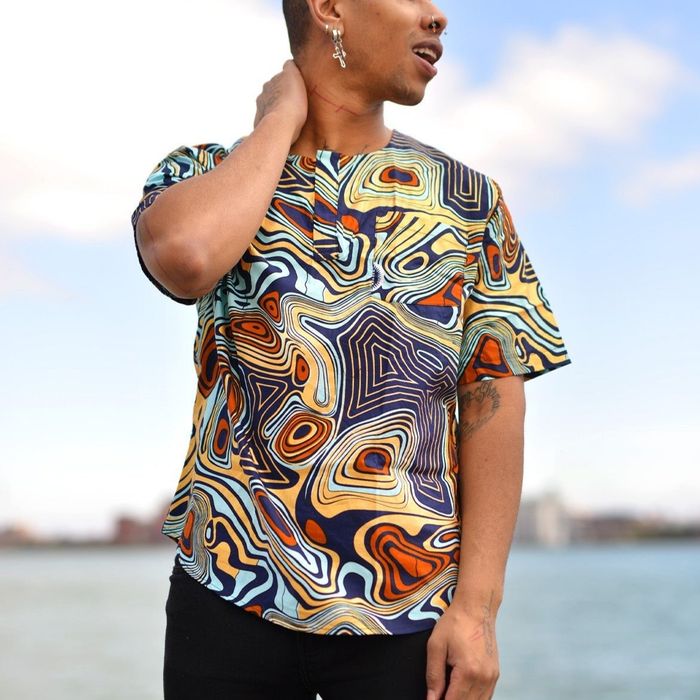 A model in a multicolor abstract print top.
