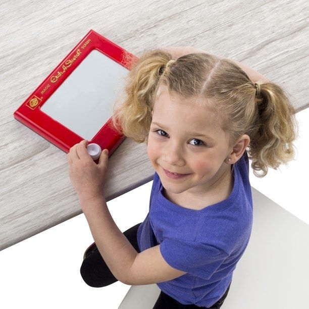 Etch A Sketch toy with kid