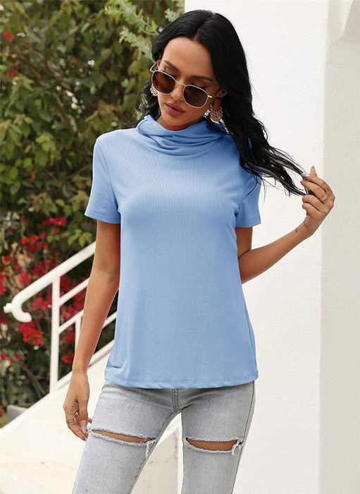 A model showcasing the blue T-shirt with the mask down