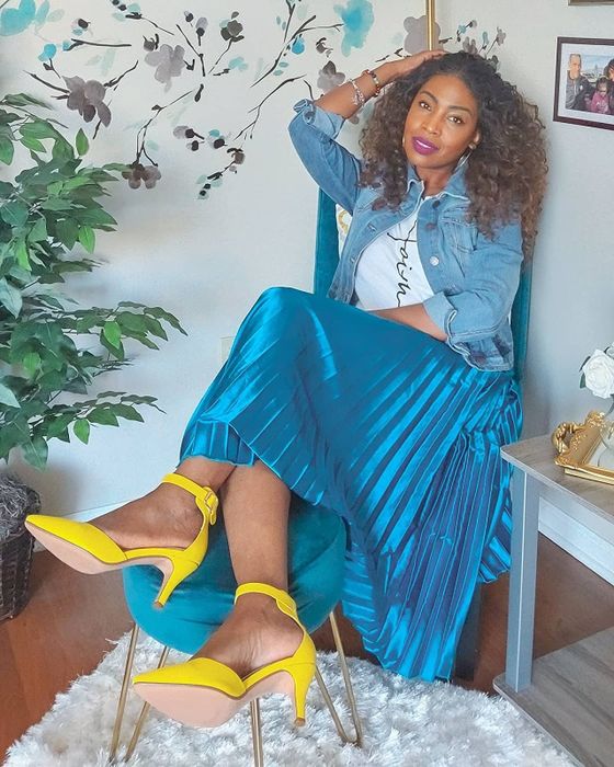 A reviewer modeling the blue metallic skirt.
