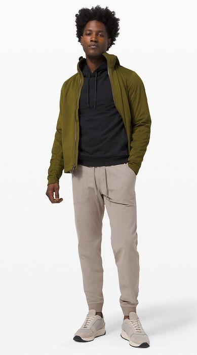 The model is wearing taupe-colored joggers.