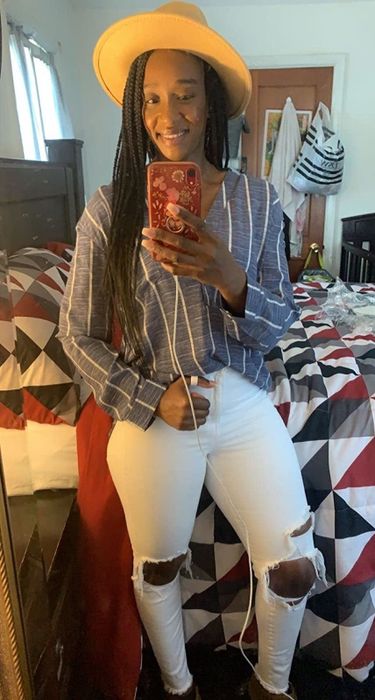 A customer review photo of them wearing the blue and white striped shirt