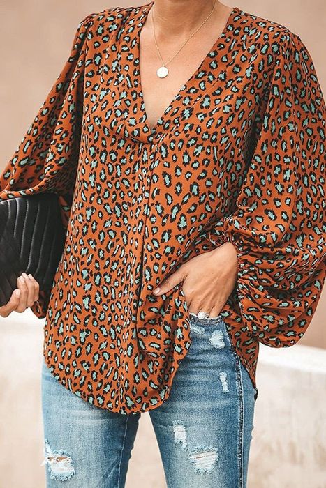 A model styling the blouse in B-brown-2