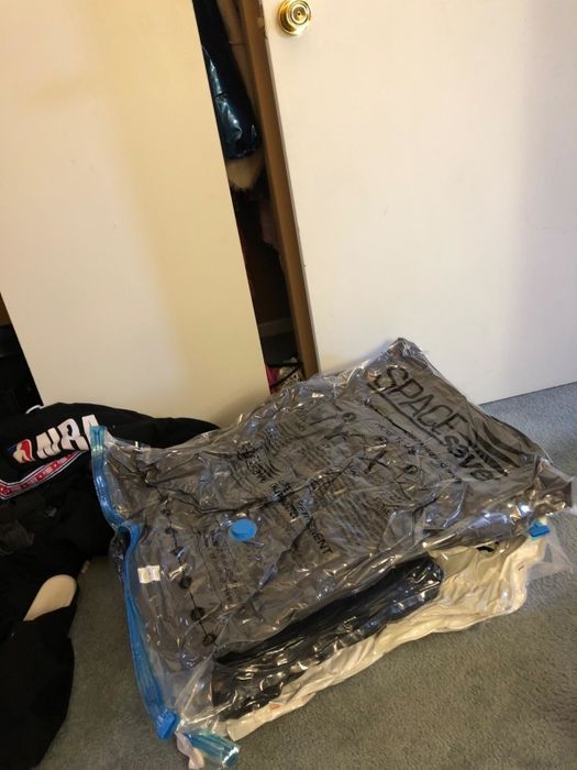 Reviewer photo of the same comforters and pillows, now flattened and packed into space saver bags