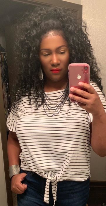 A customer review photo of the shirt being worn in white