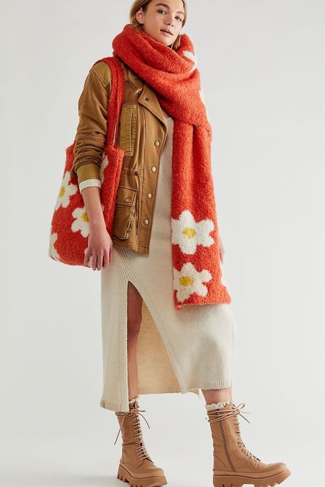 model carrying the red scarf and tote bag