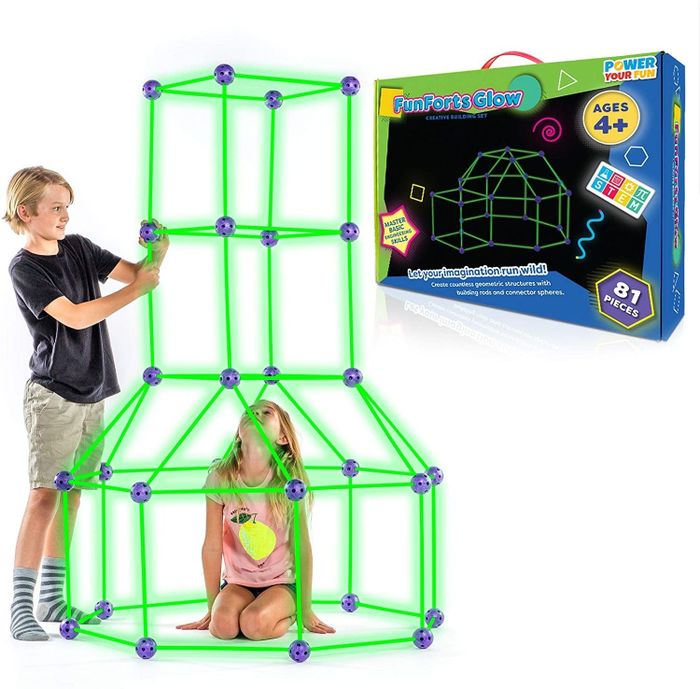 Two kids constructing a fort using poles and spheres.