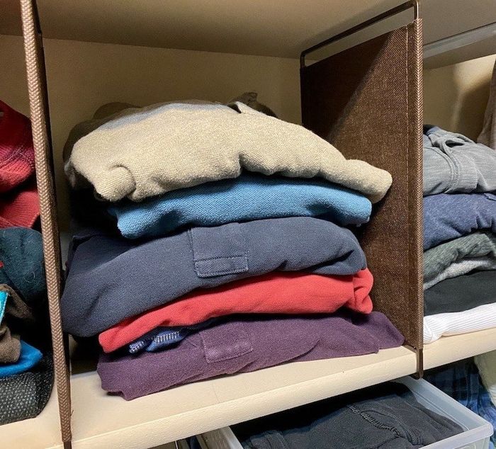 A reviewer’s photo showing a shelf where the dividers have been installed to separate items.