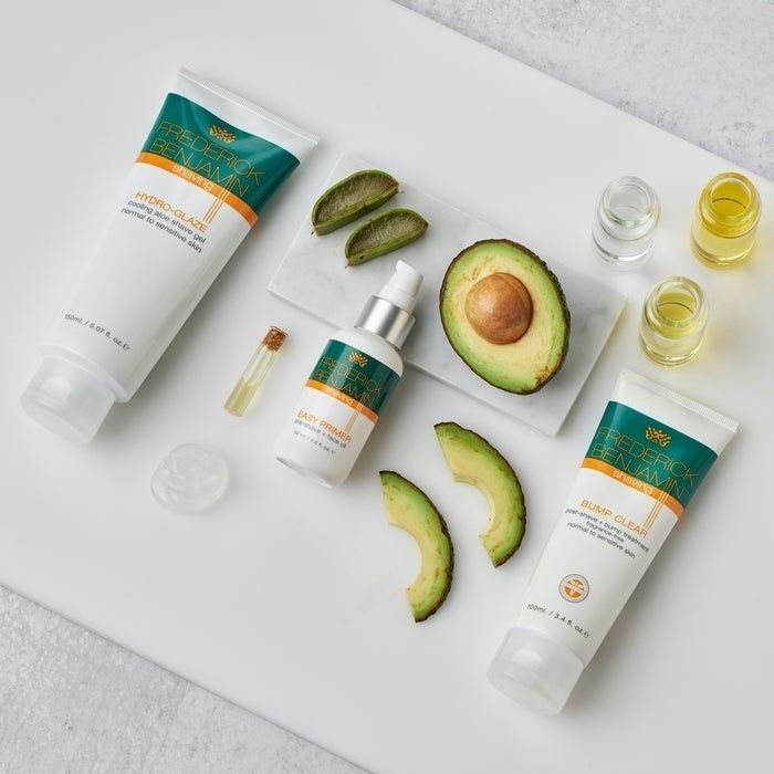 An overhead shot displaying a flatlay of the products along with their key ingredients—avocado and aloe vera.