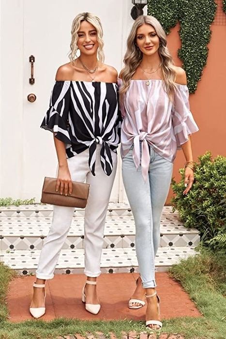 Two models showcasing the tops in black/white and light pink/white, both paired with cuffed jeans and heels