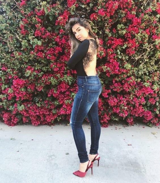 reviewer wearing black jeans and a bodysuit