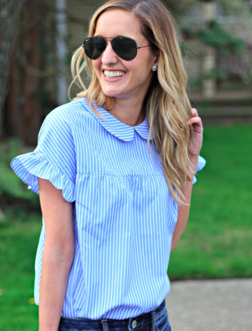 A customer review photo of them wearing the shirt in blue