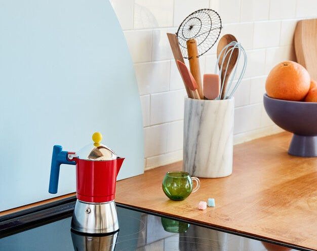 The espresso pot in yellow, blue, silver, and red