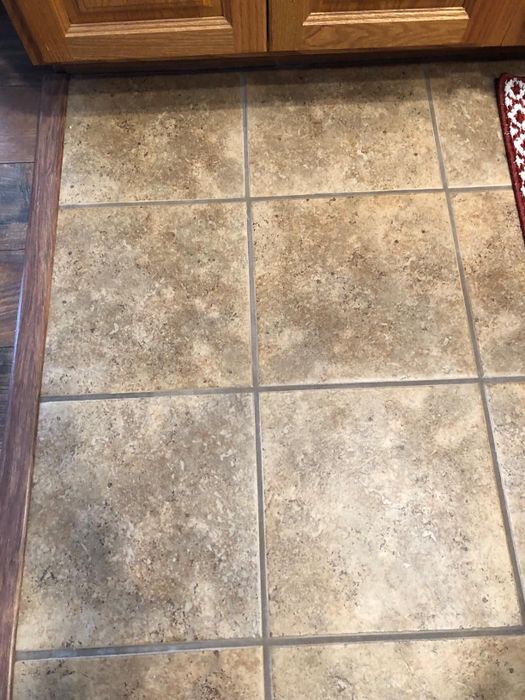 A reviewer's grout covered in dirt and grime.