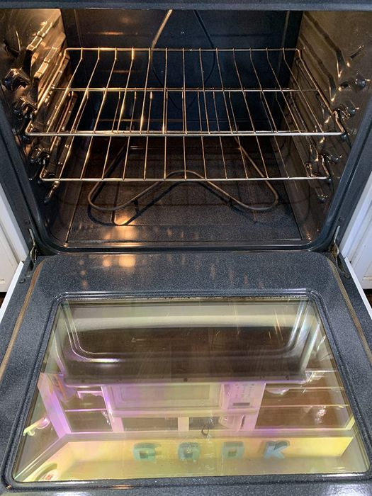The same reviewer’s after photo, showing the oven’s interior looking sparkling clean.