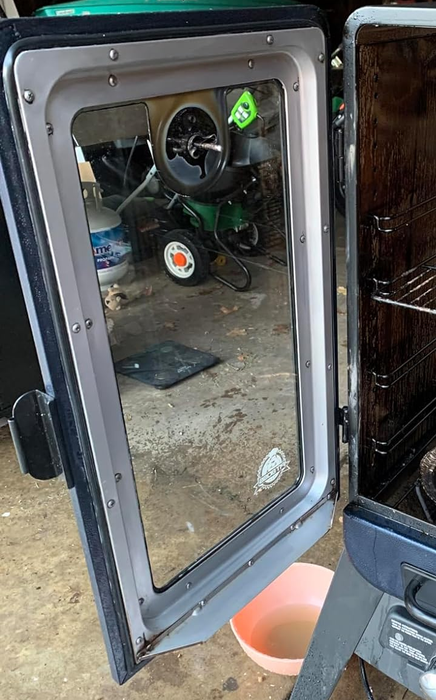 The smoker door after it has been thoroughly cleaned