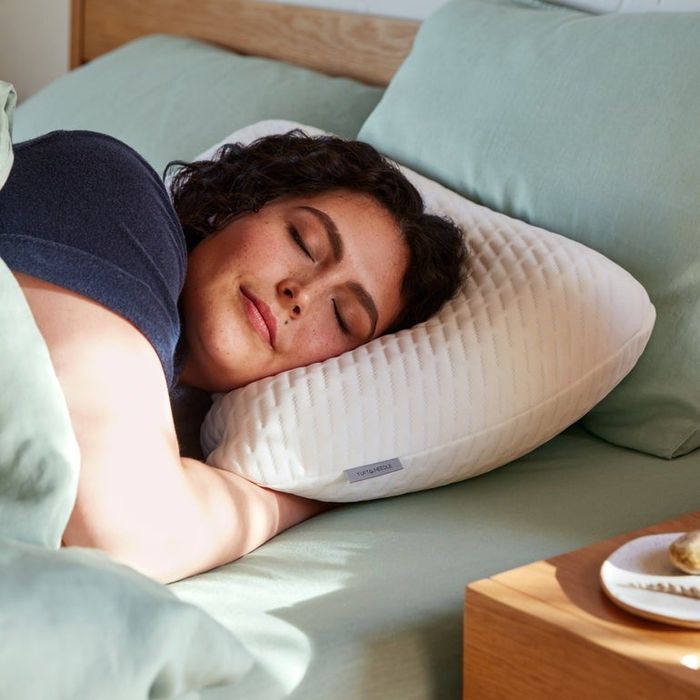 A model resting comfortably on the foam pillow