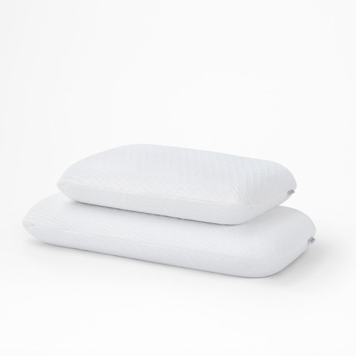 Two foam pillows stacked, with the bottom one slightly larger than the top
