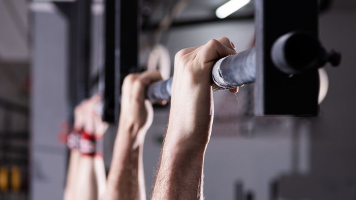 Suspending yourself from a pull-up bar