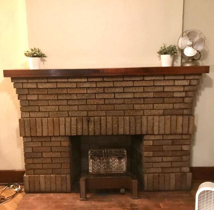 A customer review showcasing their fireplace mantel, completely soot-free after using the fireplace cleaner.