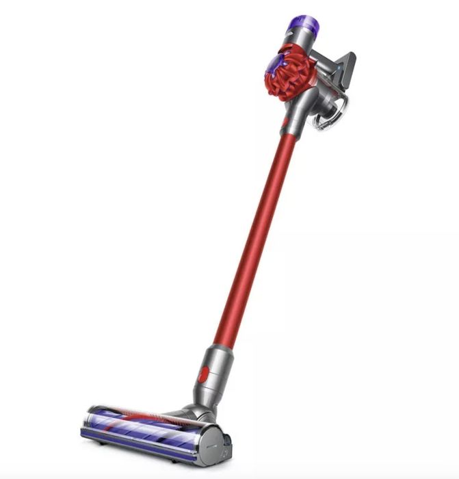 A red and purple Dyson cordless stick vacuum