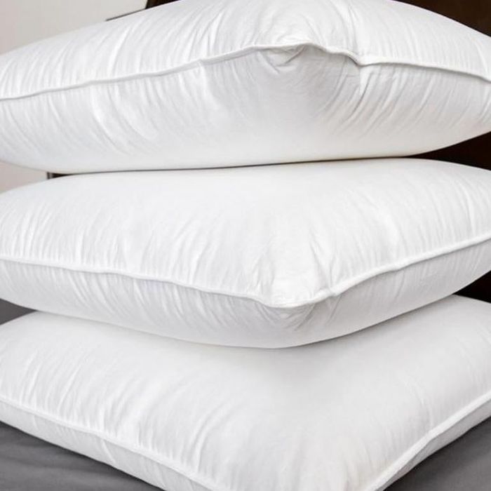 A trio of pillows neatly stacked one atop the other