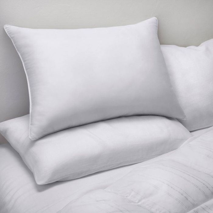 the pillows placed neatly on a bed