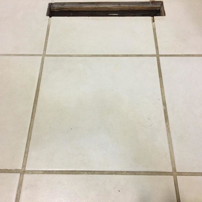 Reviewer’s white tile with dark gray grout