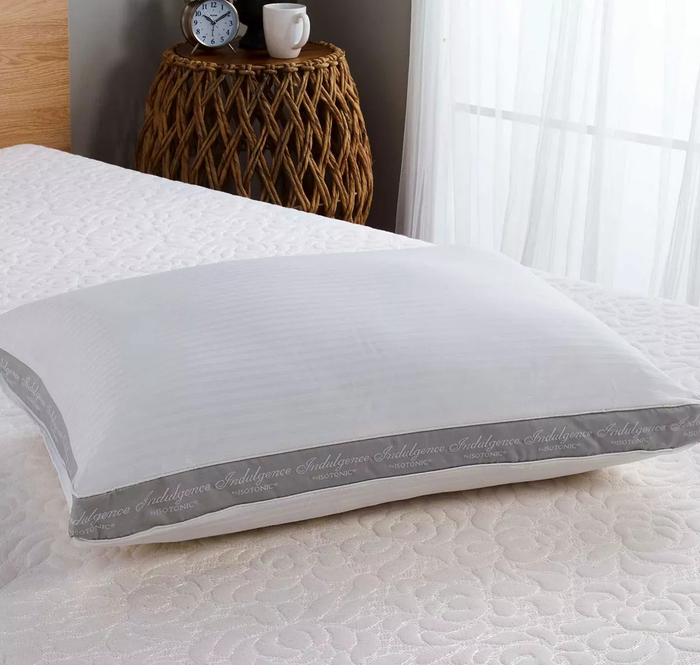 The side sleeper pillow featuring a gray gusset labeled