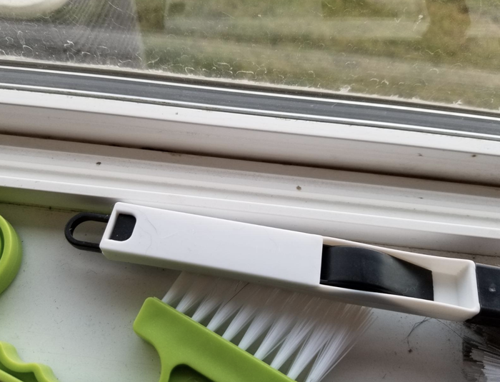 A window sill after being thoroughly cleaned, looking fresh and spotless.