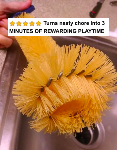 A reviewer photo showcasing the yellow garbage disposal brush.