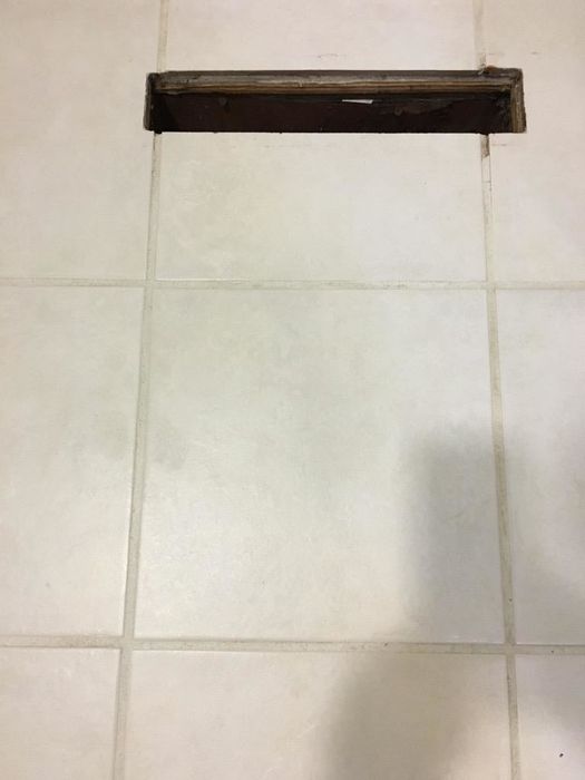 The same tile section, now with pristine white grout