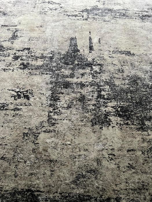 The same rug, now free of the stain after a successful cleaning process.