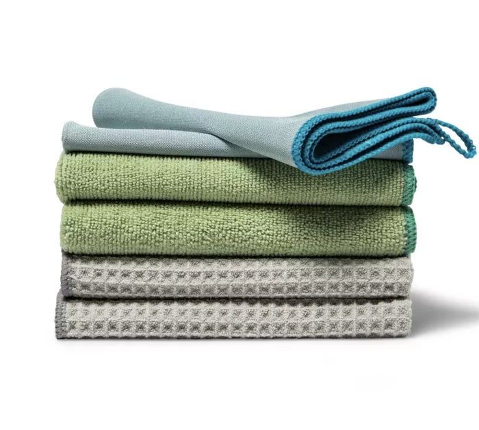 A stack of three microfiber towels with different textures.