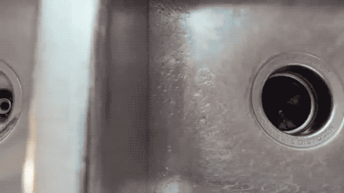 A GIF showing blue foam pouring out of the sink.