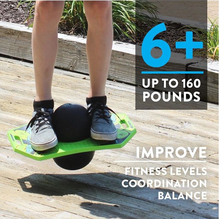 A child bouncing on a black and green pogo ball