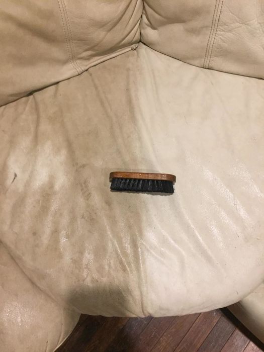 The same reviewer showcases a close-up of a couch, with one half looking dirty and the other half looking significantly brighter and more polished.