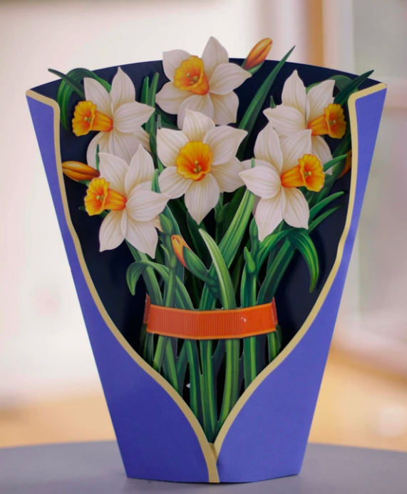Paper flower bouquet standing upright on a table