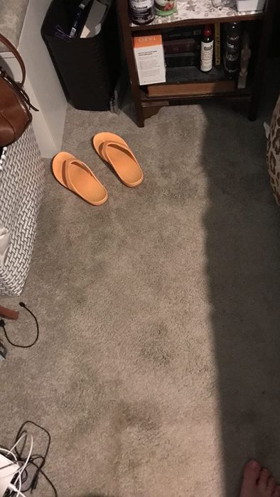 The same reviewer demonstrating how the stain is completely invisible after using the spray