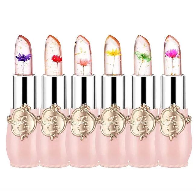 Six pink lipsticks filled with vibrant, colorful flowers inside