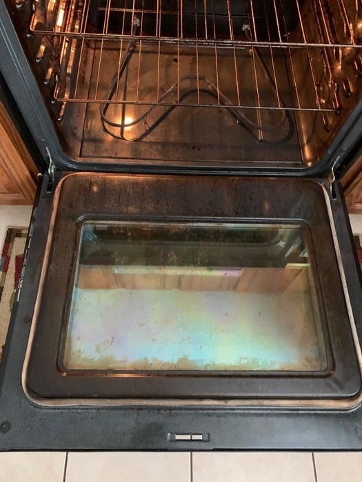 Reviewer image showing the cleaned oven after using Goo Gone cleaner