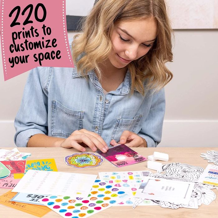 A model showcasing the kit, which includes 220 customizable prints to personalize the collage
