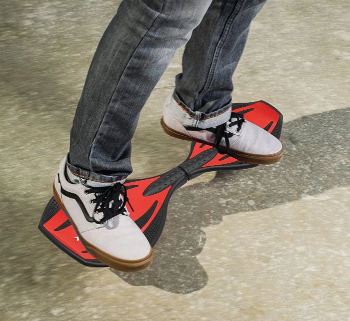 Model's sneakers positioned on a red and black board